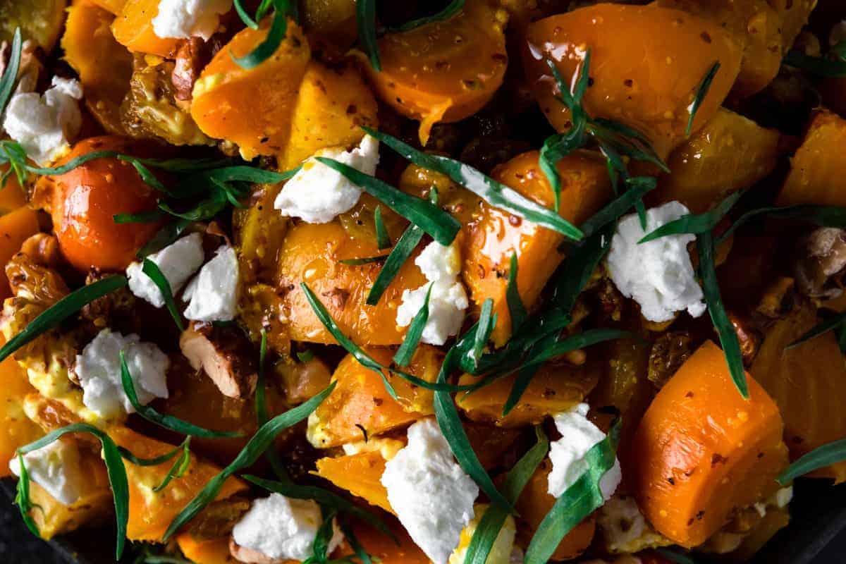 close up of golden beet salad with goat cheese and tarragon
