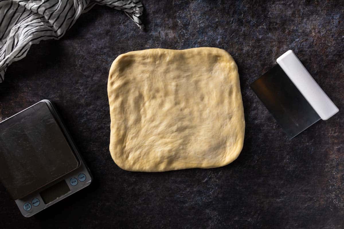 Challah bread dough pressed into a rectangle shape