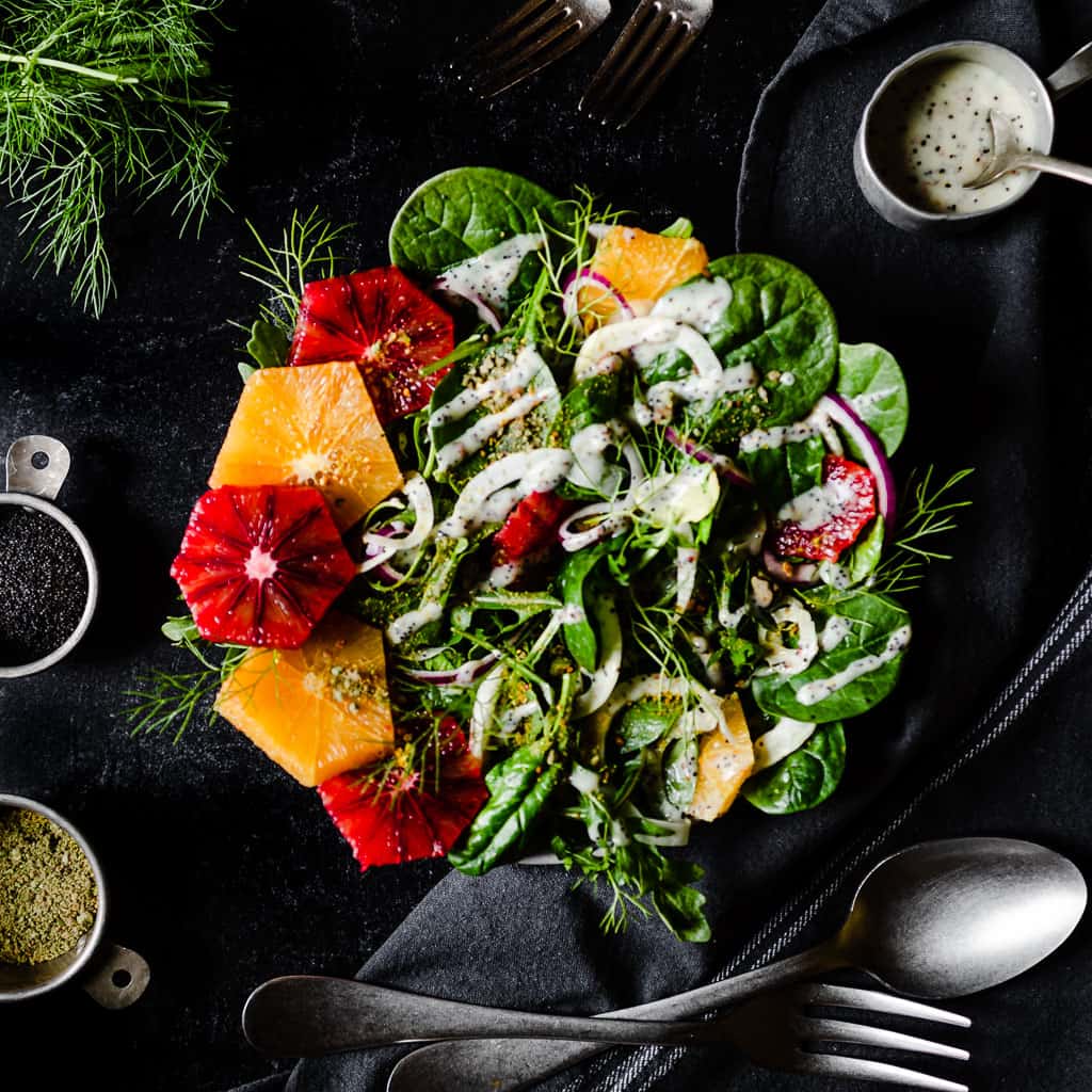 A blood orange salad with pistachios and poppy seed dressing. 