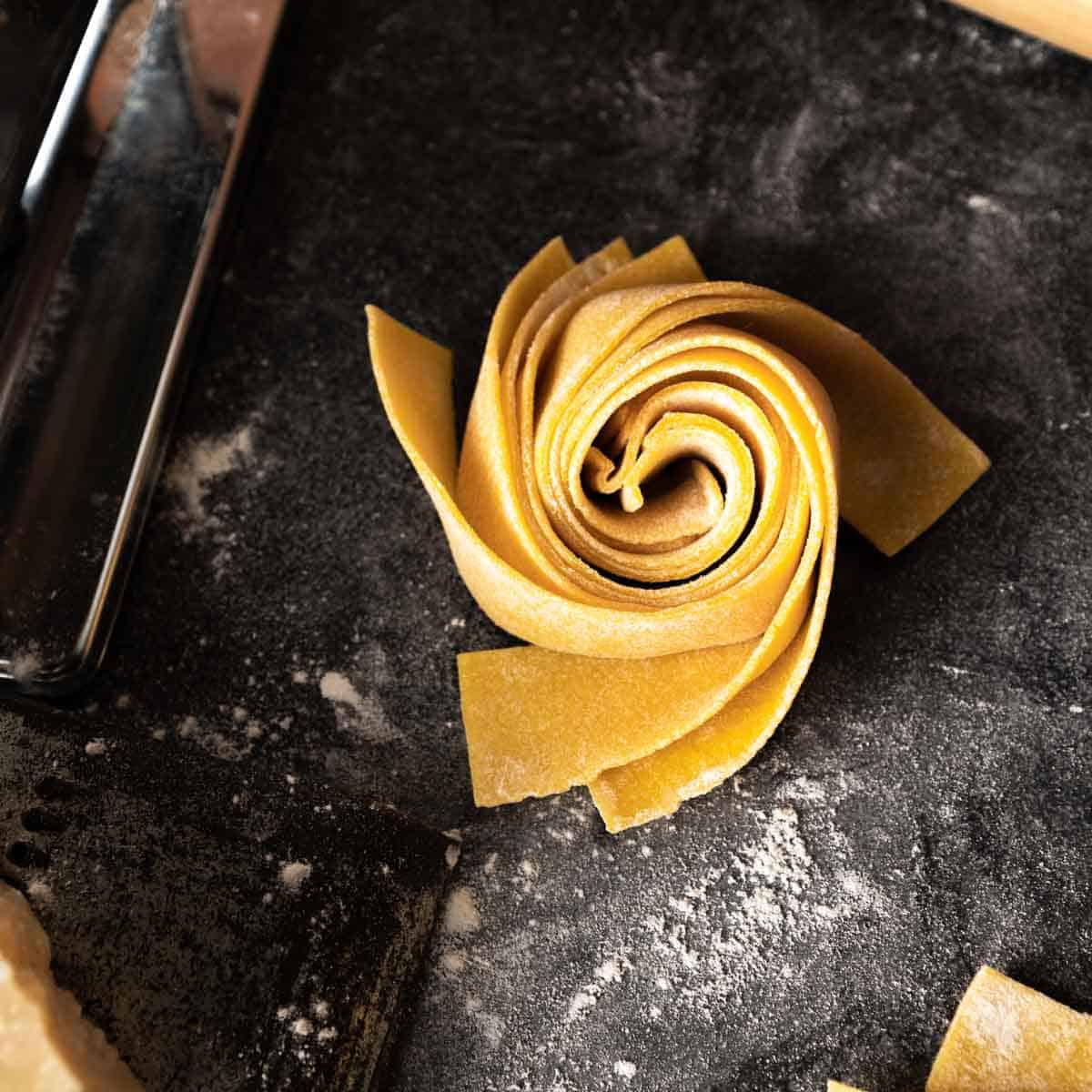 a perfect spiraled nest of hand cut pappardelle pasta
