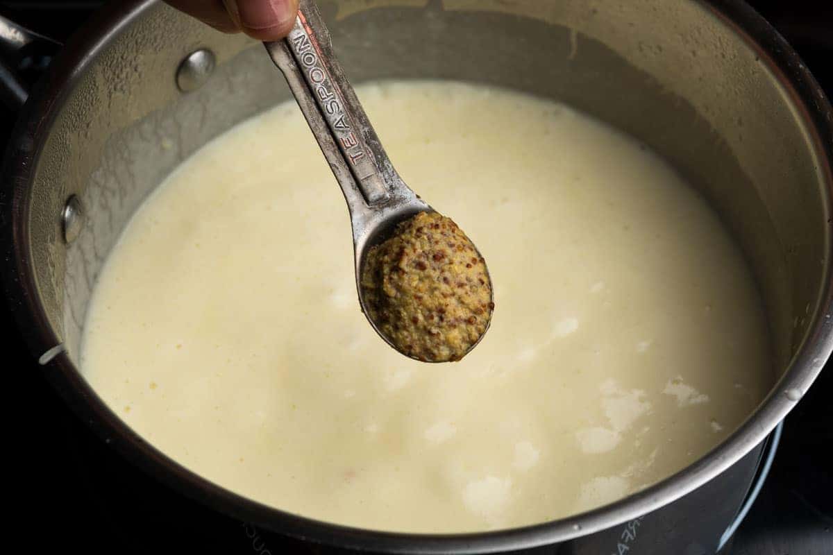 Adding a teaspoon of whole grain Dijon mustard into the mornay