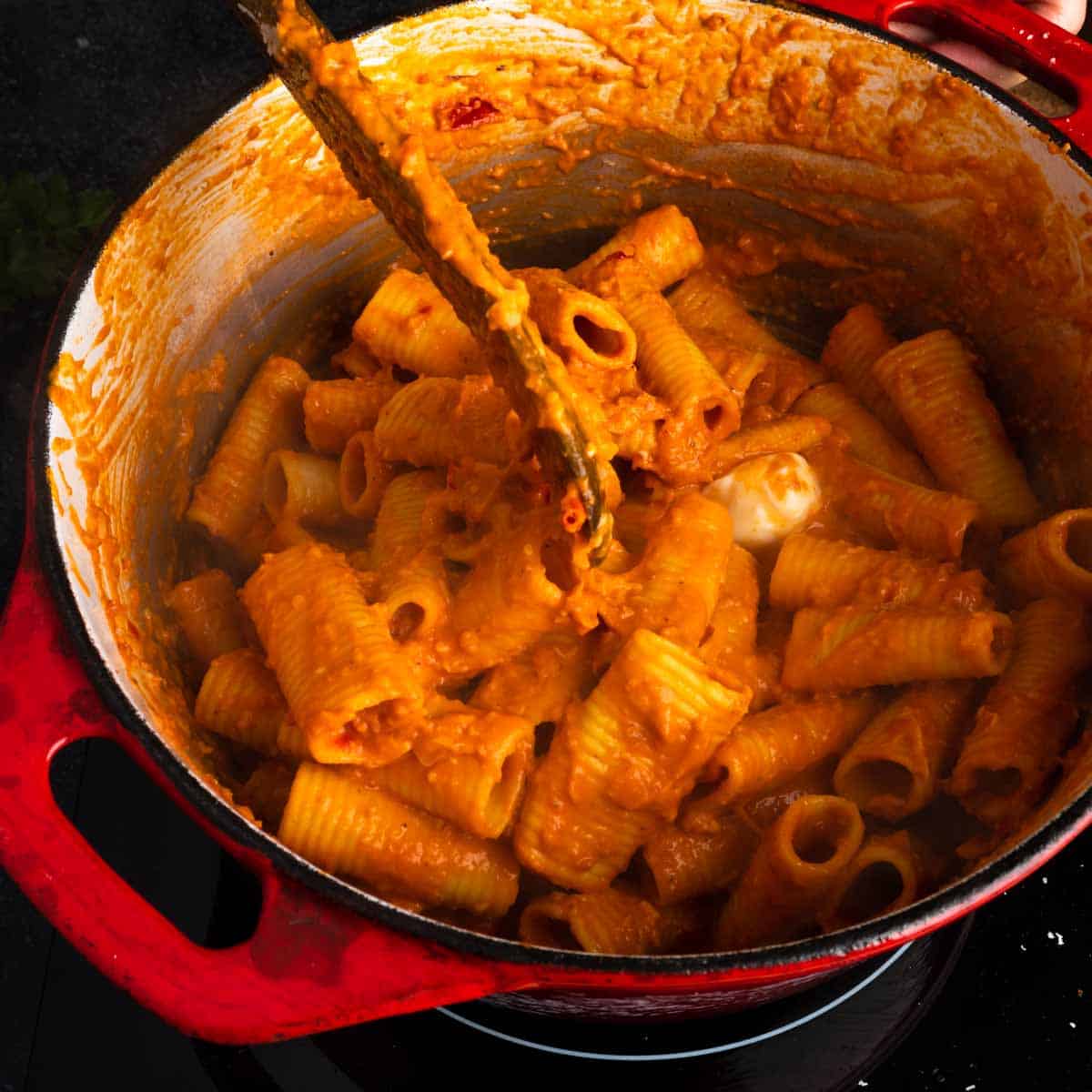 Stirring rigatoni allav nduja vodka together with a little butter