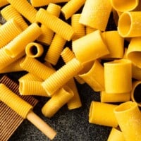 A close-up image of hand made rigatoni and paccheri with semolina pasta dough