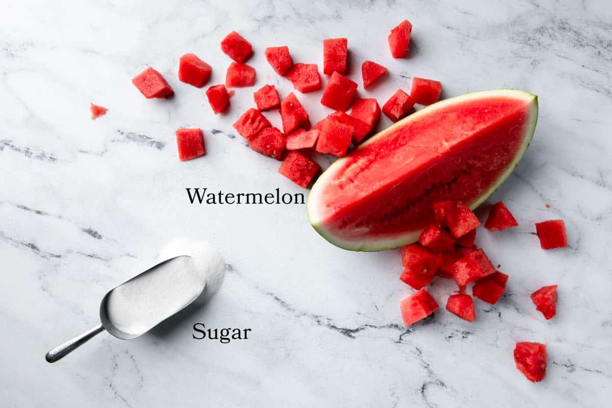 A picture of seedless watermelon and a scoop of sugar