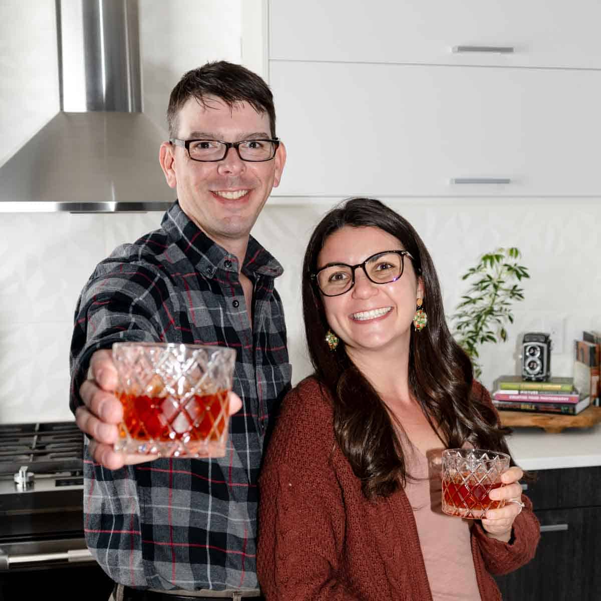 Scott and Taylor Woodworth holding cocktails