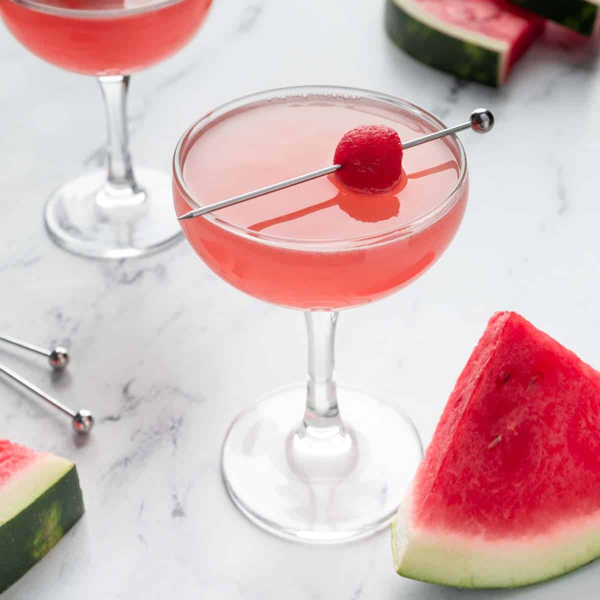 A photo of a watermelon martini garnished with a melon ball