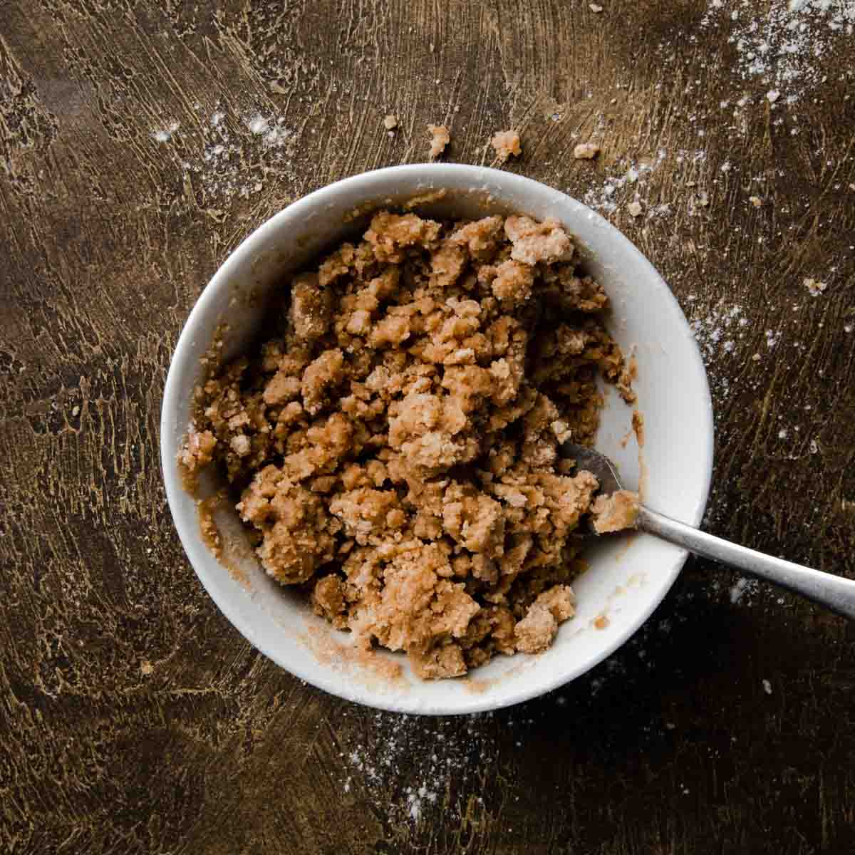 Cinnamon streusel crumble mixed together in a bowl
