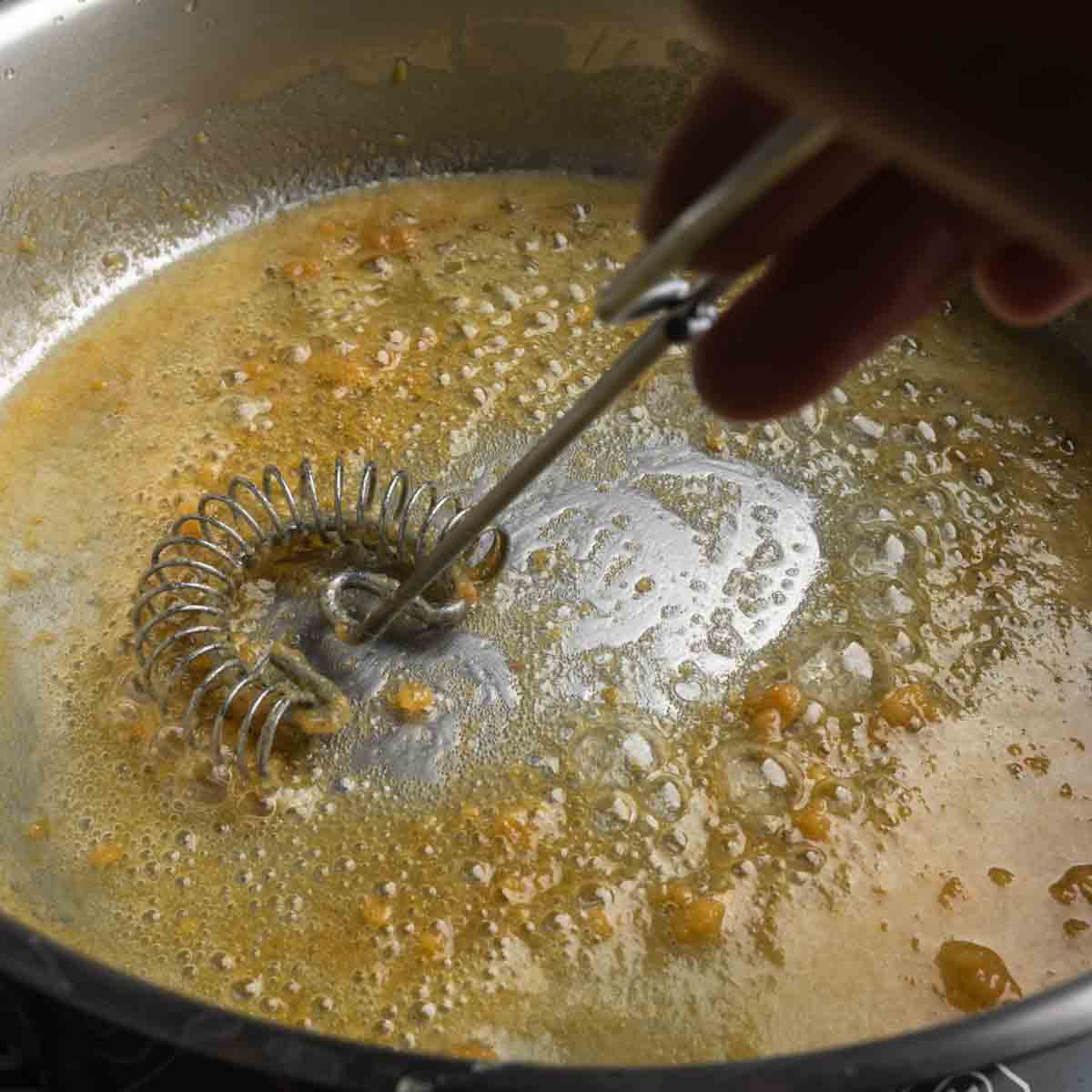 Whisking the miso paste into the melted butter