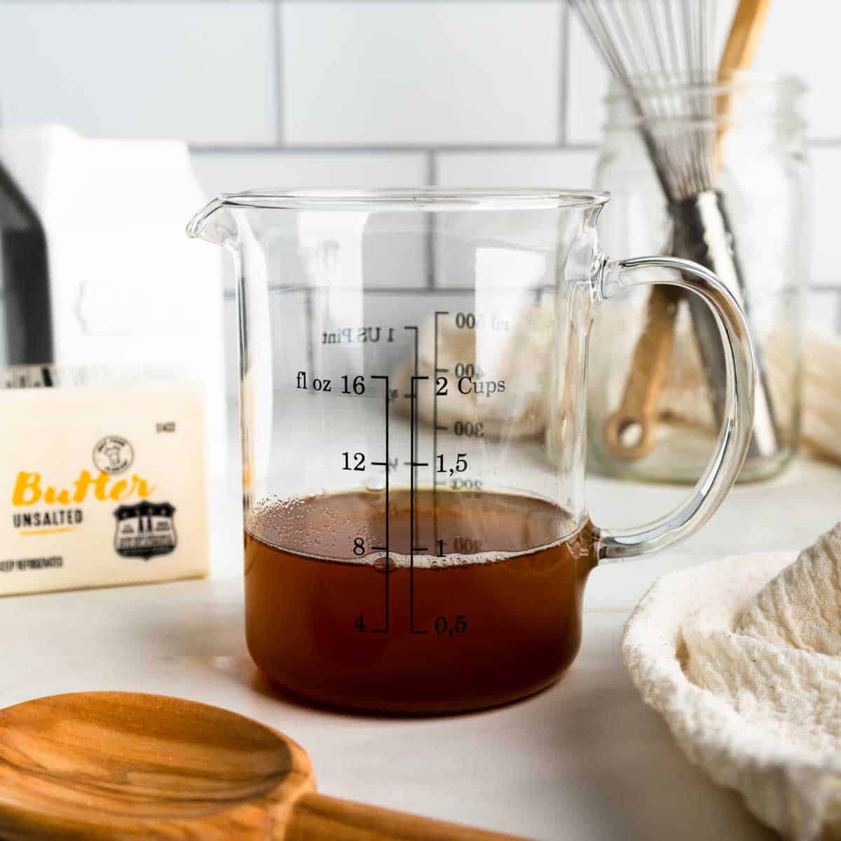 I scant cup of melted brown butter in a glass measuring cup