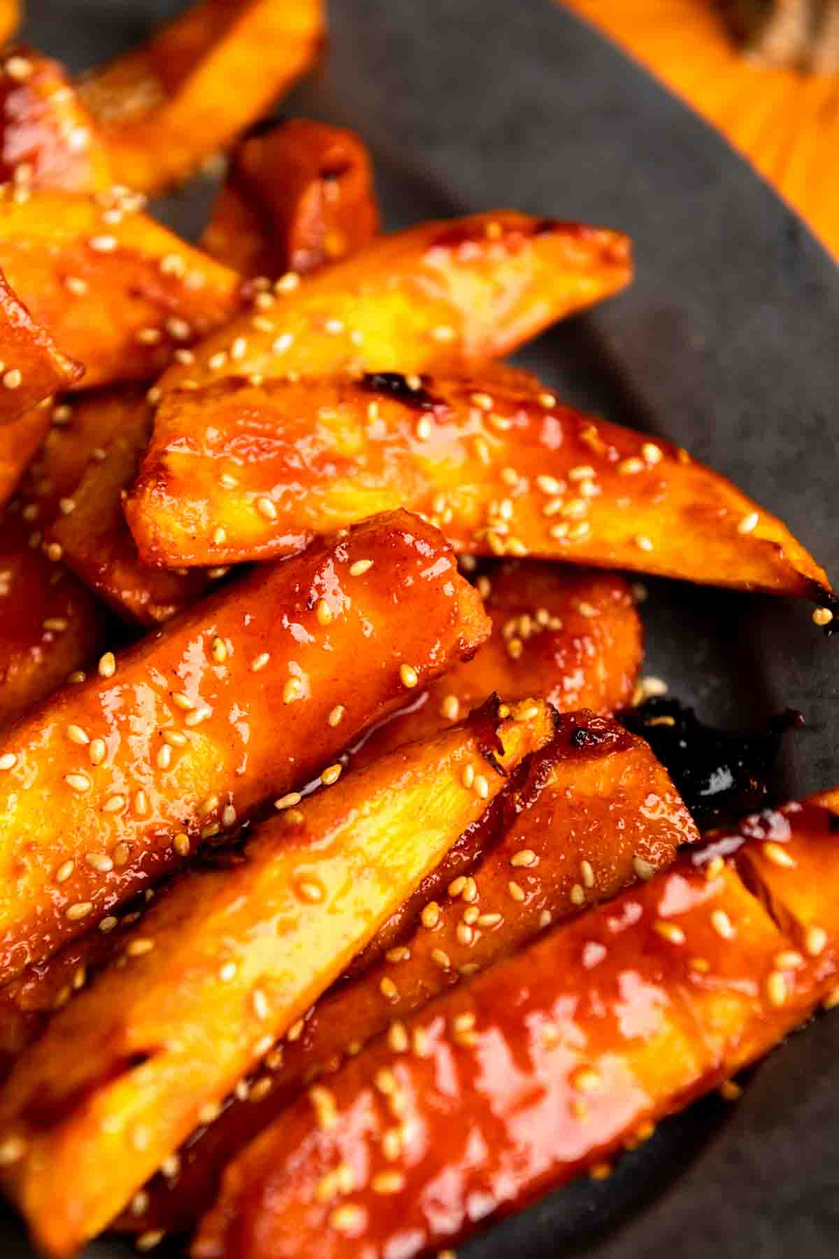 Shiny glazed wedges of pumpkin with gochujang and maple.