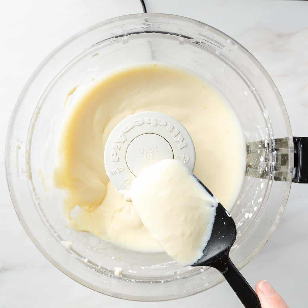 Perfectly smooth whipped ricotta filling on a rubber spatula. 